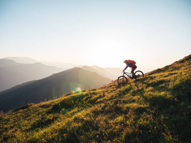 Mountain biker riding downhill in the mountains.